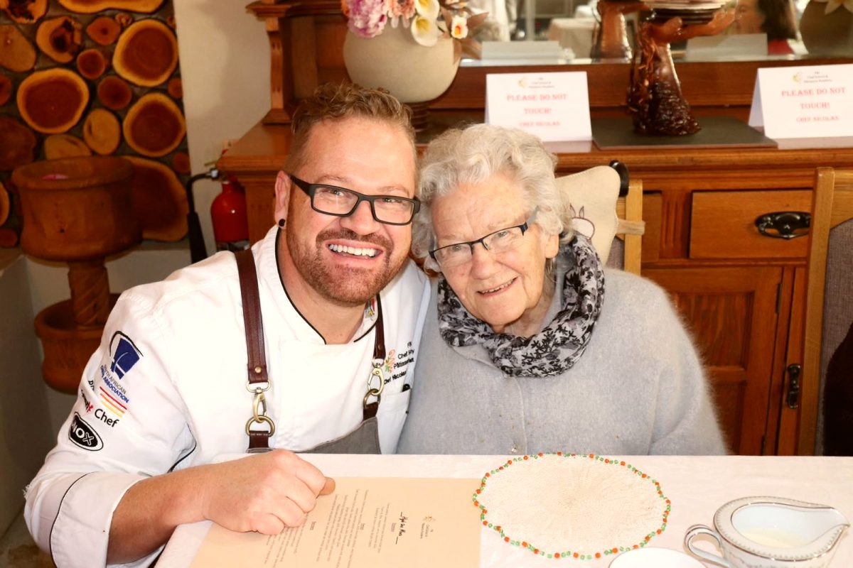 Nicolaas with his ouma, Lammie, at a table he cooked for her